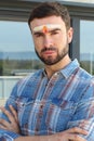 Spiritual man with third chakra painted on forehead