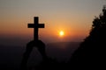 Spiritual prayer hands over sun shine with blurred beautiful sunset background Royalty Free Stock Photo