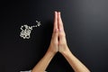 Spiritual prayer to god, with verve or rosary in the hands of a young girl. Black background. Close-up Royalty Free Stock Photo