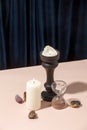 Spiritual session, tarot cards advisor, fortune telling consultation concept. Various magical objects by table. Candles burning,