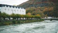 Spiritual Waters: Lourdes Cityscape with a Holy River Beneath Azure Skies