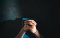 Spirituality, Religion and Hope Concept. Person Praying by Holy Bible on Desk. Symbol of Humility, Supplication,Believe and Faith Royalty Free Stock Photo