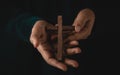 Spirituality, Religion and Hope Concept. Person with Wooden Cross on Hands. Symbol of Humility, Supplication, Believe and Faith