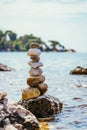 Spirituality and wellness: Cairns on a pebble beach