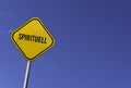 Spirituell - yellow sign with blue sky background