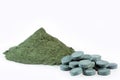 Spirulina algae powder and tablets. Spirulina