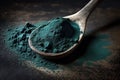 Spirulina powder close up. Dark background.