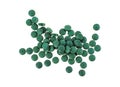 Spirulina tablets isolated on white background Royalty Free Stock Photo