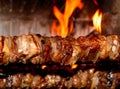 Spit roast with meat cooked on a spit in the fireplace 1 Royalty Free Stock Photo