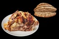 Spit Roasted Pork Ham With Brown Bread Slices Isolated On Black