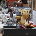 Spitalfields Antic Market. hundred years old sad teddy bear on the flea market