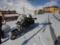 Spiti, Himachal Pradesh, India - April 7th, 2021 : Winter landscape in a fabulous location, Bike riding in snow covered village in