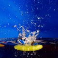 Splash background with sinking apple
