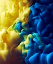 Splash of blue and yellow color paint pigment