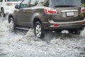 Splash by a car as it goes through flood water Royalty Free Stock Photo