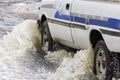 Splash by a car as it goes through flood water Royalty Free Stock Photo