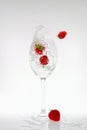 Splash of carbonated water in a glass with strawberries Royalty Free Stock Photo