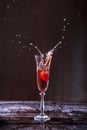 Splash of Champagne and Strawberries into a glass Royalty Free Stock Photo