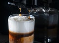 Splash of coffee and milk in white cup isolated on black background movement action delicious, natural, white, tasty Royalty Free Stock Photo