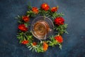 Splash in a cup of tea. Marigold frame. Flat lay. Blue background. Morning still life, tea time Royalty Free Stock Photo