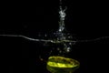 Splash of fresh starfruit water on a black background Royalty Free Stock Photo