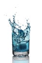 Splash in glass of blue alcoholic cocktail drink with ice cube Royalty Free Stock Photo