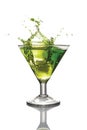 Splash in glass of green alcoholic cocktail drink with ice Royalty Free Stock Photo