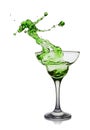 Splash in glass of a green alcoholic cocktail drink Royalty Free Stock Photo