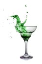 Splash in glass of a green alcoholic cocktail drink Royalty Free Stock Photo