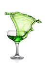 Splash in glass of a green alcoholic cocktail drink Royalty Free Stock Photo