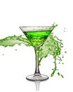 Splash in glass of a green alcoholic cocktail drink Royalty Free Stock Photo