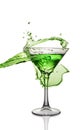 Splash in glass of a green alcoholic cocktail drink Royalty Free Stock Photo