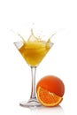 Splash in glass of yellow alcoholic cocktail drink with orange Royalty Free Stock Photo