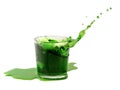 Splash from ice cube in a glass of green water or drink Royalty Free Stock Photo