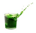 Splash from ice cube in a glass of green water or drink Royalty Free Stock Photo