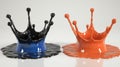 A splash of liquid in vivid neon orange and cyan against a white background forms an abstract, artistic pattern Royalty Free Stock Photo