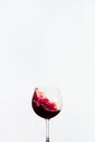 Splash red water in a wine glass with white background Royalty Free Stock Photo