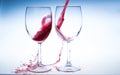 Splash red wine glass against a white background Royalty Free Stock Photo