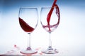 Splash red wine glass against a white background Royalty Free Stock Photo