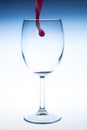 Splash red wine glass against a white background Royalty Free Stock Photo
