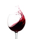 Splash of red wine in a glass isolated on  white Royalty Free Stock Photo