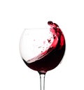 Splash of red wine in a glass isolated on  white Royalty Free Stock Photo