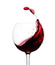 Splash of red wine in a glass isolated on  white Royalty Free Stock Photo