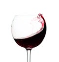 Splash of red wine in a glass isolated on  white Royalty Free Stock Photo