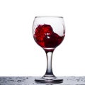 Splash of red wine in a glass similar to an explosion Royalty Free Stock Photo