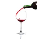 Splash red wine glass against a white background Royalty Free Stock Photo