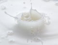 Splash and splashes from falling milk like a crown Royalty Free Stock Photo