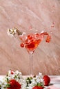 Splash of strawberry cocktail in martini glass Royalty Free Stock Photo