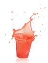 Splash of strawberry juice in a plastic cup Royalty Free Stock Photo