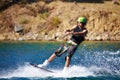 Splash, surf and wakeboarding with man in lake for extreme sports, summer break and travel vacation. Wave, adrenaline Royalty Free Stock Photo